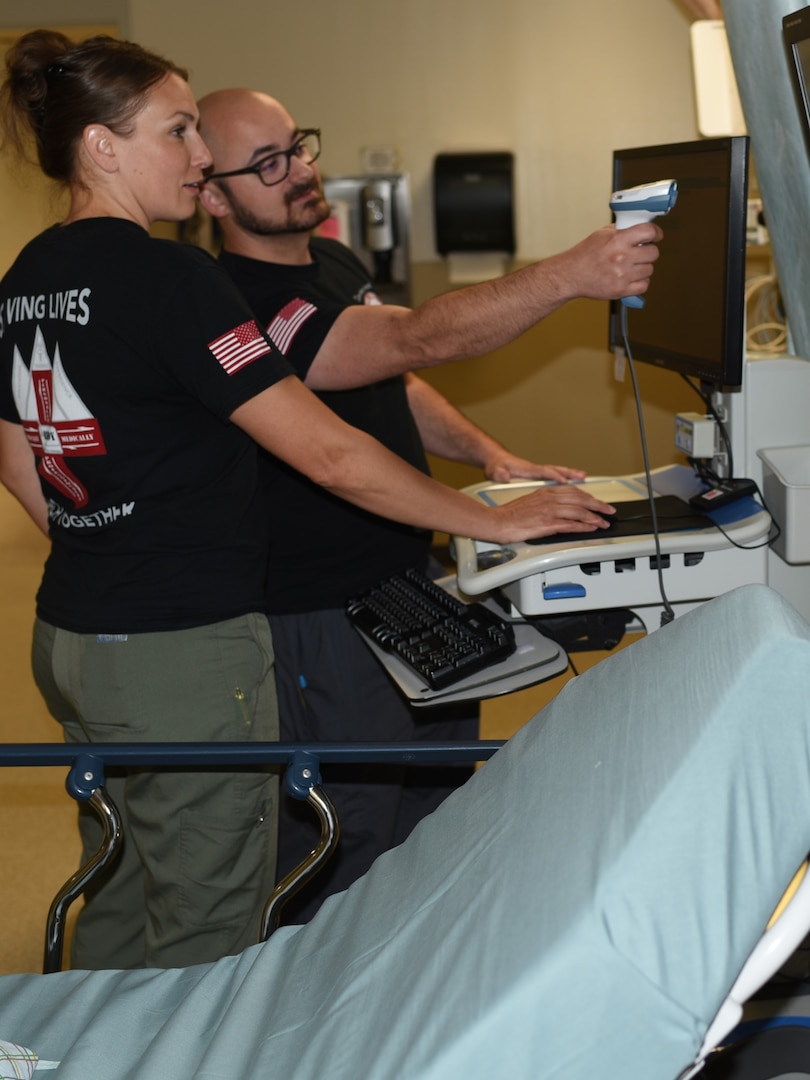 Thomas Belanger, the Assistant Clinical Nurse Officer-In-Charge of Preadmissions Testing for the Evans Army Community Hospital Post Anesthesia Care Unit, and Sam Payne, a registered nurse in the PACU, demonstrate the capabilities of the hospital's new Phase II Extended Observation room, which streamlines the process for recovering surgery patients, and increases capacity in the family care ward.