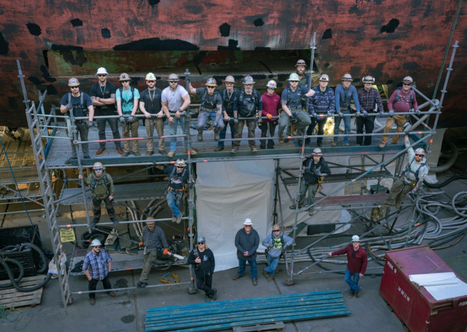 Trident Refit Facility, Bangor’s shipwrights pose for a photo in the dry dock at TRFB. U.S. Navy photo by MC2 Sarah Christoph.