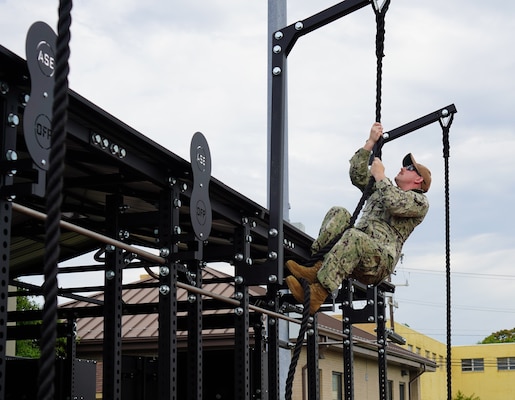 Sailors residing at the Huntington Hall Naval Berthing Facility in Newport News, Virginia, try out some of the new exercise equipment at an outdoor MWR fitness pavilion.