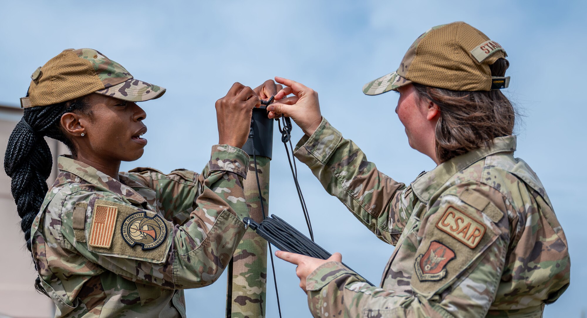 920th Communications Flight expeditionary communications technicians, secure rope on a rolatube