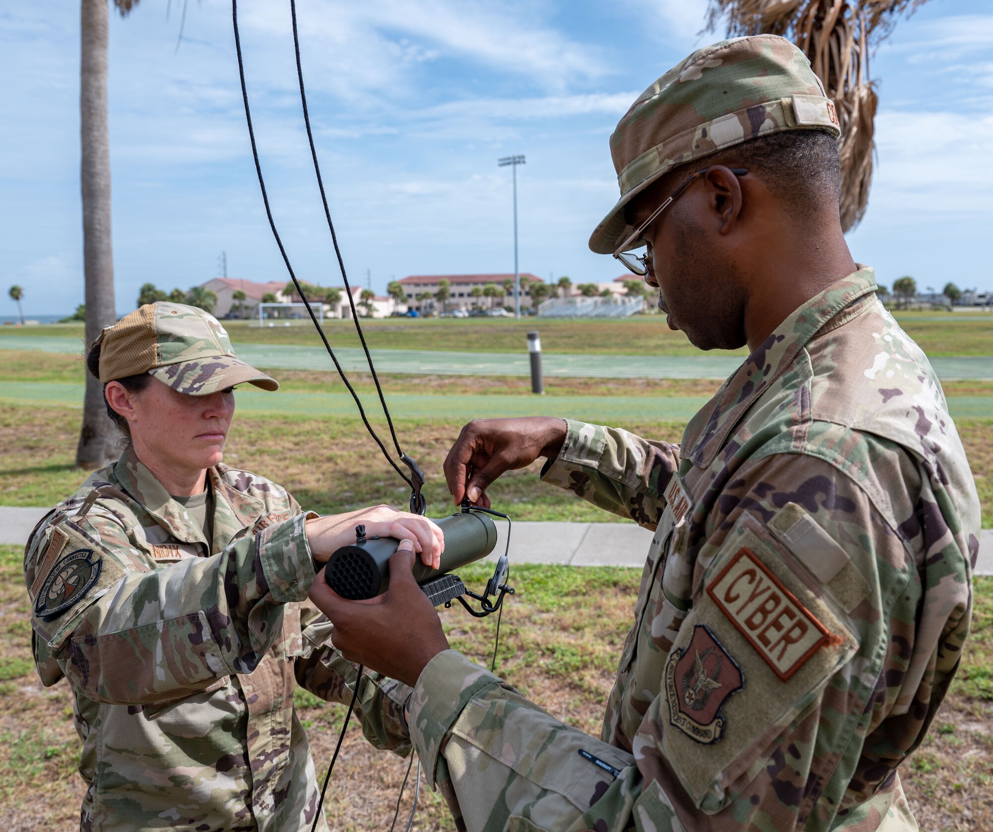 920th Communications Flight expeditionary communications technicians, secure a Raven High Frequency antenna
