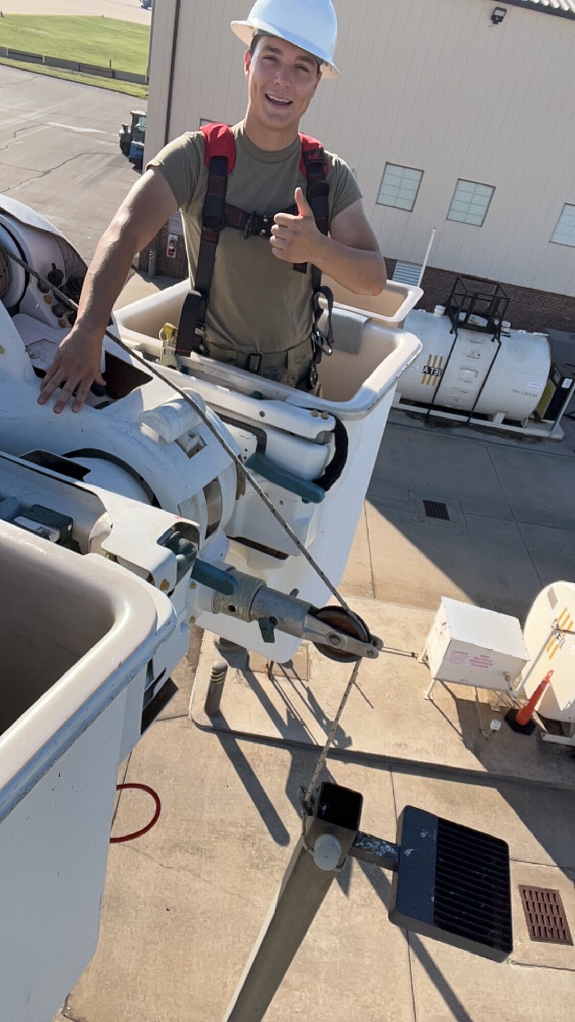 U.S Air Force Airman 1st Class Noah Melero, 97th Civil Engineer Squadron electrical systems apprentice, troubleshoots a lighting circuit in a bucket truck at Altus Air Force Base (AFB), Oklahoma. Melero was the crew leader in installing 12 new LED light fixtures for the outdoor recreation area at the Altus AFB Youth Center. (Courtesy photo by Baylor Downing)