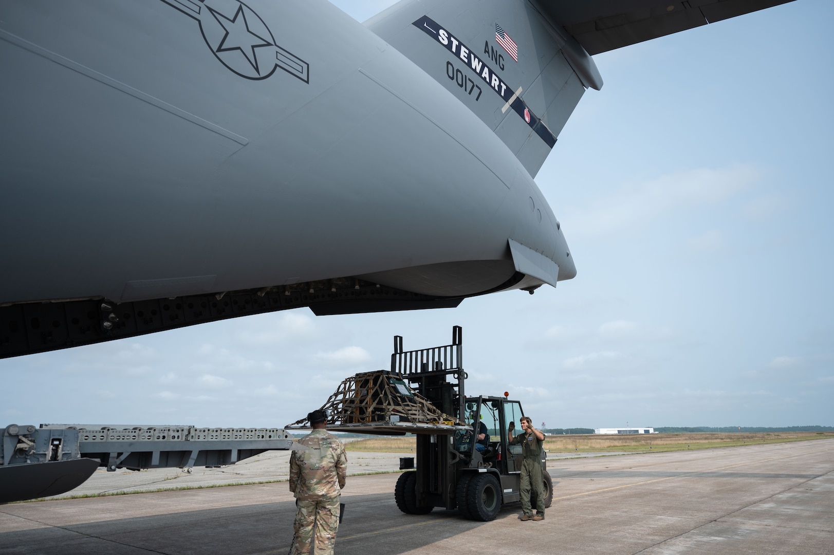 Loadmaster directs a forklift.