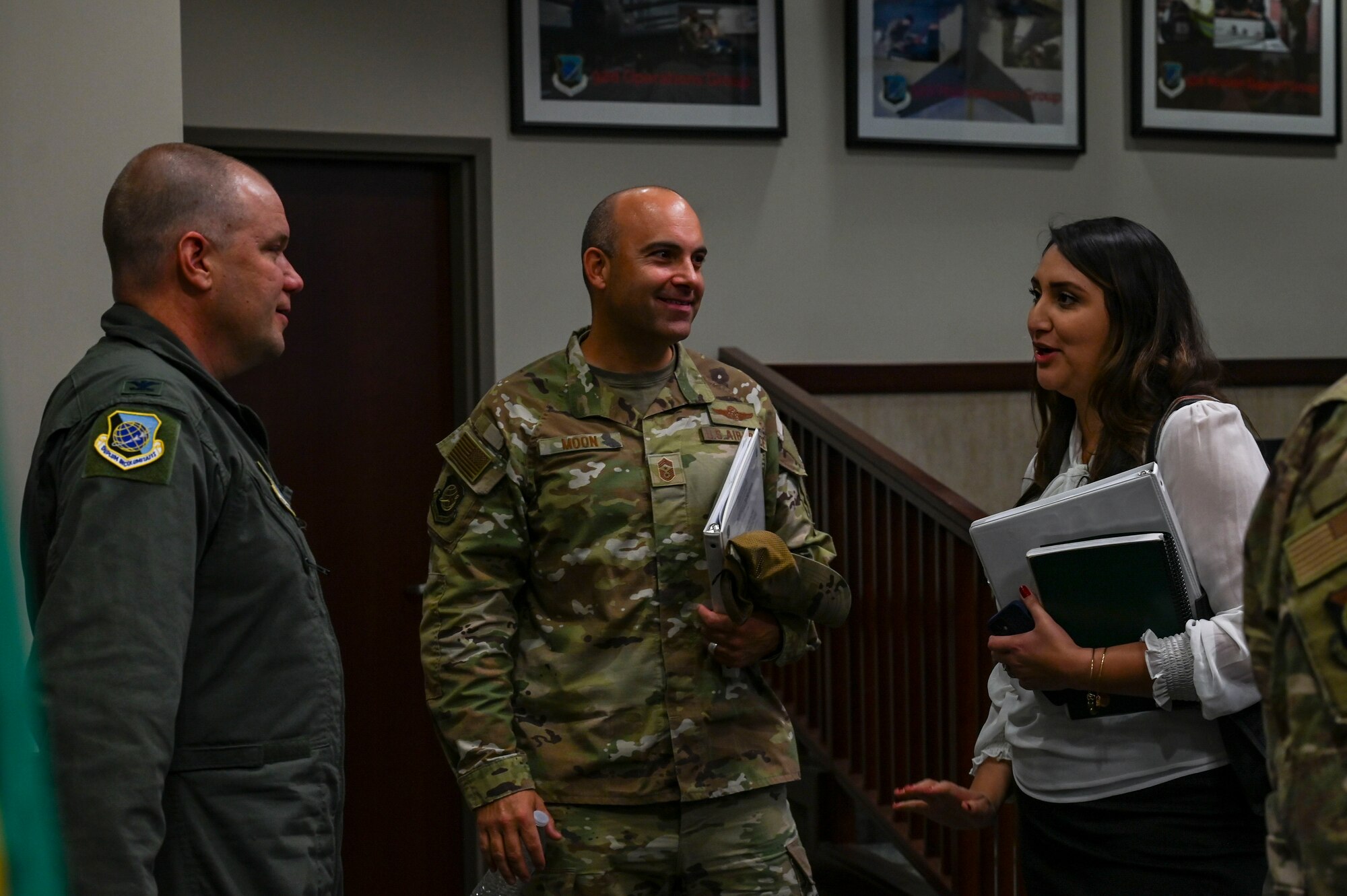 A woman speaks to Fairchild command leadership.