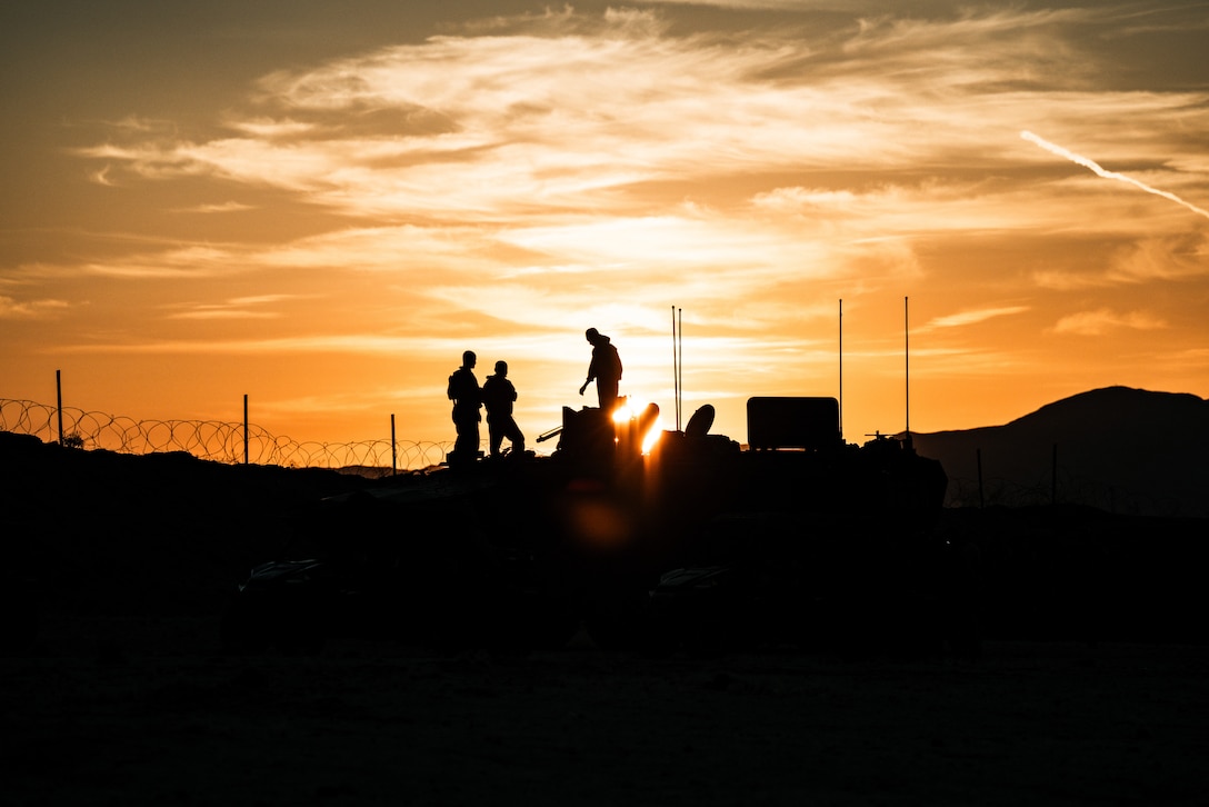 U.S. Marines with 3rd Battalion, 5th Marine Regiment, 1st Marine Division, prepare an amphibious combat vehicle for an urban raid attack during an Adversary Force Exercise as a part of Service-Level Training Exercise 5-24 at Range 220, Marine Corps Air-Ground Combat Center, Twentynine Palms, California, Aug. 6, 2024. SLTE 5-24 is purpose built to train, develop, and validate the Infantry Battalion Experiment as part of a larger Marine Air-Ground Task Force operation as a Stand-in Force across a contested multi-domain distributed environment. (U.S. Marine Corps photo by Cpl. Hunter Wagner)