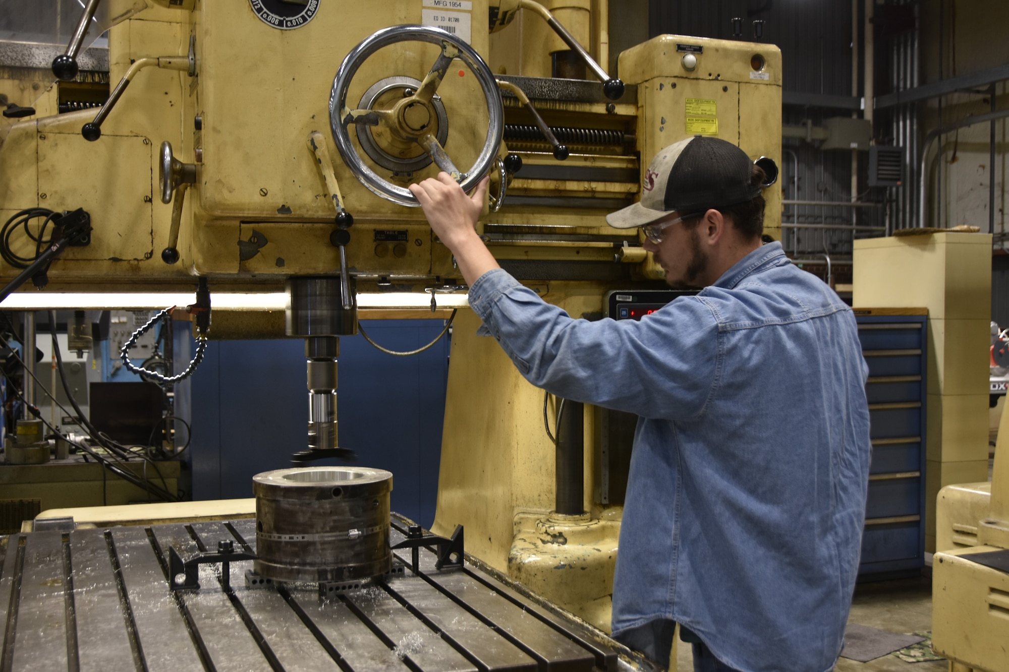 Peyton Teters, an aerospace precision machinist in the Arnold Engineering Development Complex Model and Machine Shop at Arnold Air Force Base, Tenn., uses one of the new boring heads July 30, 2024, the Model Shop purchased using innovation grant funding received in 2024 through the AEDC Spark Tank program. The boring heads include technology that measures bored openings in equipment and features built-in digital readouts which allow machinists to quickly see whether a hole meets required specifications. (U.S. Air Force photo by Bradley Hicks)