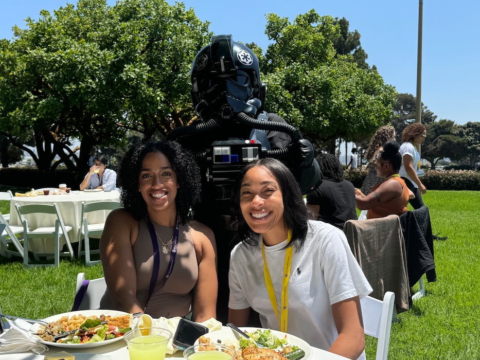 Photo of two girls outside posing for a photo.