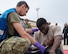 An Airman assigned to the 5th Medical Group tends to a simulated casualty during a major accident response exercise (MARE) at Minot Air Force Base, North Dakota, Aug. 21, 2024. MAREs provide realistic training opportunities for Airmen to enhance response procedures in the event of a real-world incident. (U.S. Air Force photo by Senior Airman Kyle Wilson)