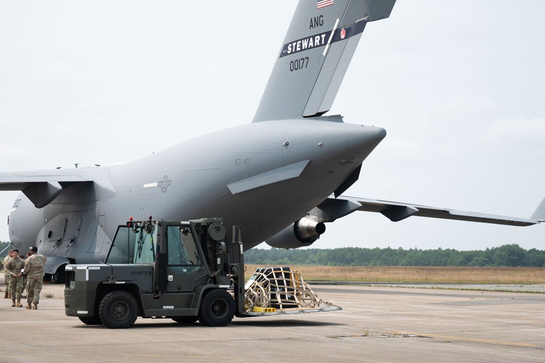 Loadmaster directs a forklift.