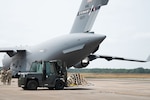Loadmaster directs a forklift.