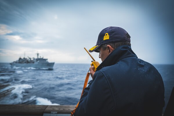 Cmdr. Marco Felici, commanding officer of the Italian Navy Carlo Bergamini-class frigate ITS Carabiniere (F 593) speaks on a radio