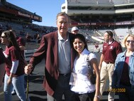 U.S. Air Force 1st Lt. Claudia Hinchey, 9th Medical Group resource management and commander’s support staff flight commander, poses for a photo with former President George H.W. Bush when she attended Texas A&M University, Texas, in Fall 2008. (Courtesy Photo)