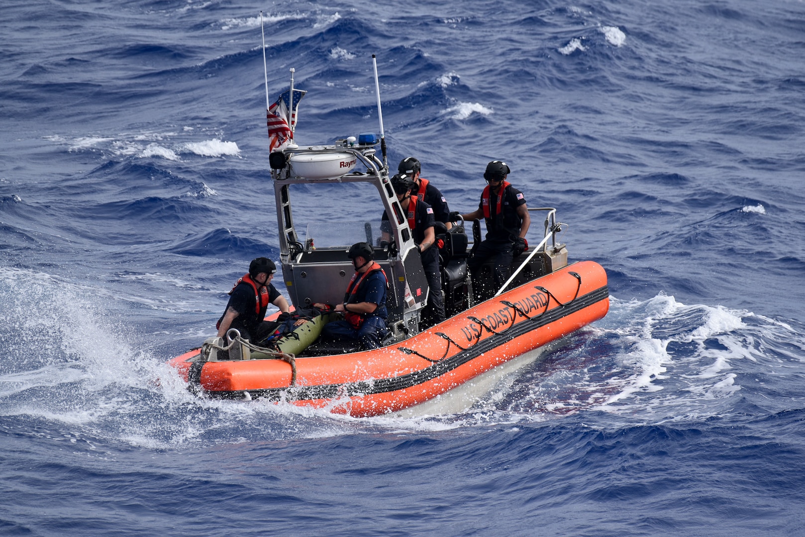 A Coast Guard Cutter Harriet Lane small boat crew transits a 53 year-old crew member from the commercial fishing vessel Autumn to the Harriet Lane off the coast of Oahu Aug. 22, 2024.