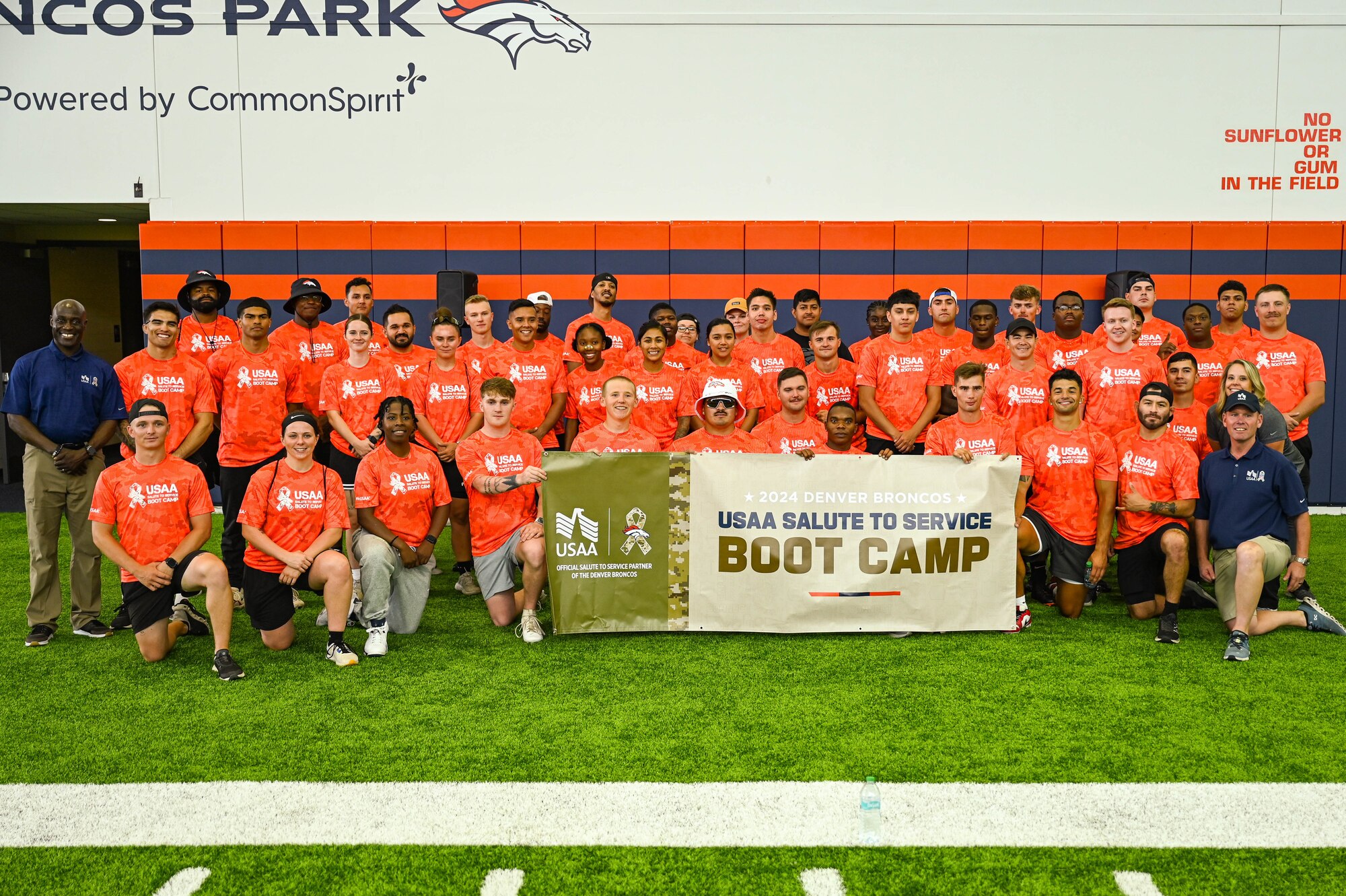group photo of people on football field