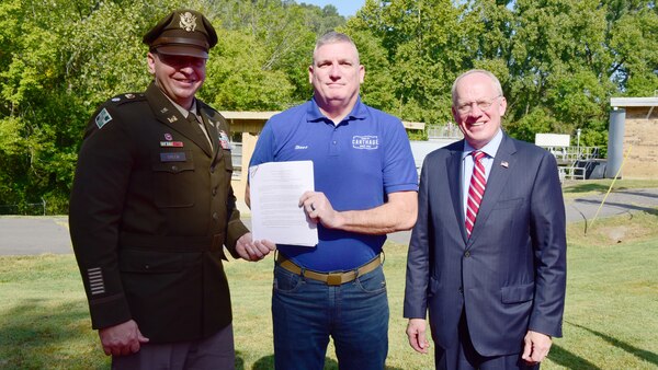 Lt. Col. Stephen Green, U.S. Army Corps of Engineers Nashville District commander; Mayor Steve Babcock of Carthage, Tennessee (Middle); and Congressman John Rose, Tennessee 6th District, pose after Green and Babcock signed a Project Partnership Agreement Aug. 23, 2024, in Carthage, Tennessee. The agreement officially begins a streambank stabilization project on the Cumberland River that will prevent further bank erosion that currently endangers the Carthage Wastewater Treatment Plant. (USACE Photo by Lee Roberts)