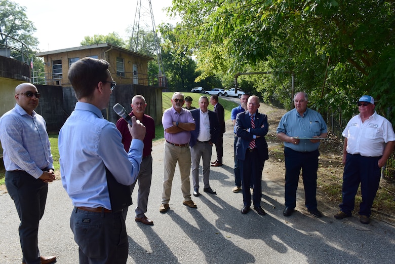 Chris Pickering (holding microphone), U.S. Army Corps of Engineers Nashville District’s project manager for the Carthage Wastewater Treatment Plant Streambank Stabilization Project, briefs Congressman John Rose (wearing red and white striped tie), Tennessee 6th District, officials and guests about the Carthage Wastewater Treatment Plant Streambank Stabilization Project following an official signing of the Project Partnership Agreement Aug. 23, 2024. (USACE Photo by Lee Roberts)