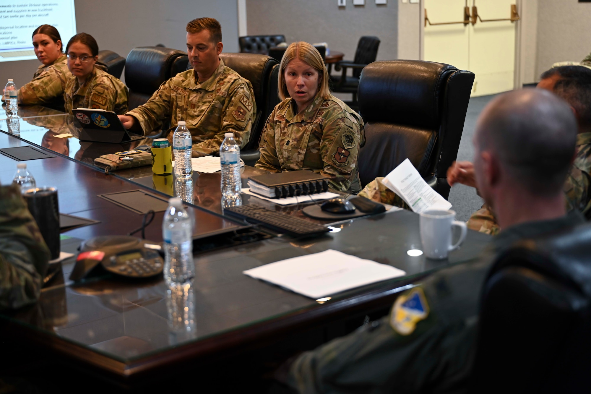 U.S. Air Force Lt. Col. Kristen Torma, 49th Maintenance deputy commander, presents Project Iron Agility tactics training program to the base commander at Holloman Air Force Base, Aug. 9, 2024. The maintenance knowledge curriculum taught at PIA implements training tactics and procedures to prepare Airmen for deployment scenarios. (U.S. Air Force photo by Airman 1st Class Michelle Ferrari)
