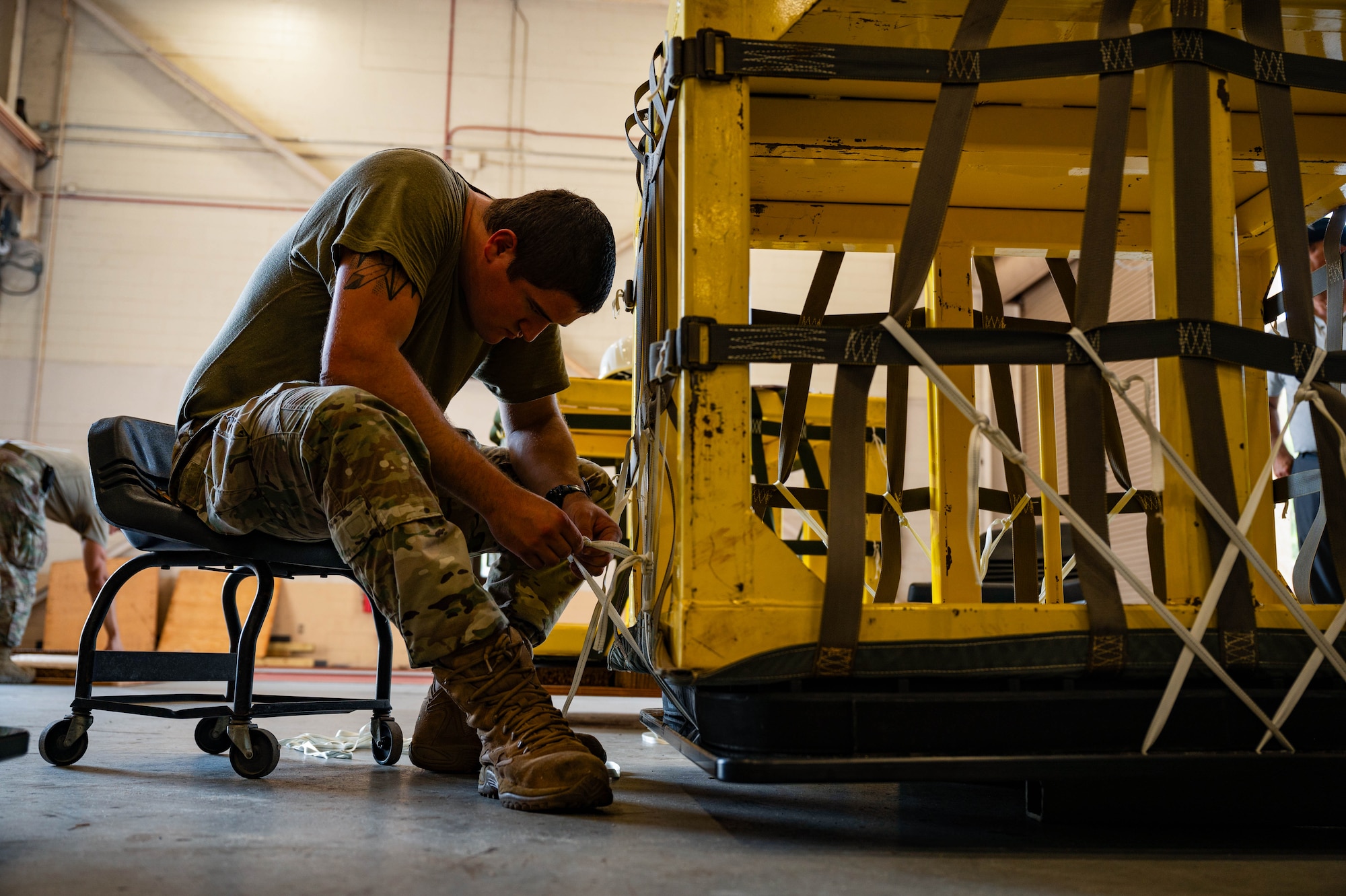 Air transportation specialists build pallets and implement necessary safety and security precautions for handling, storing and transporting materials.