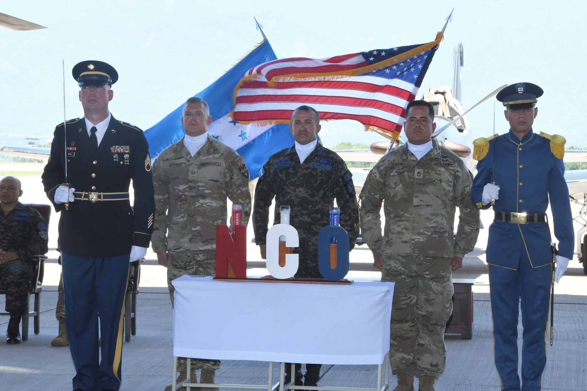A photo of service members standing.