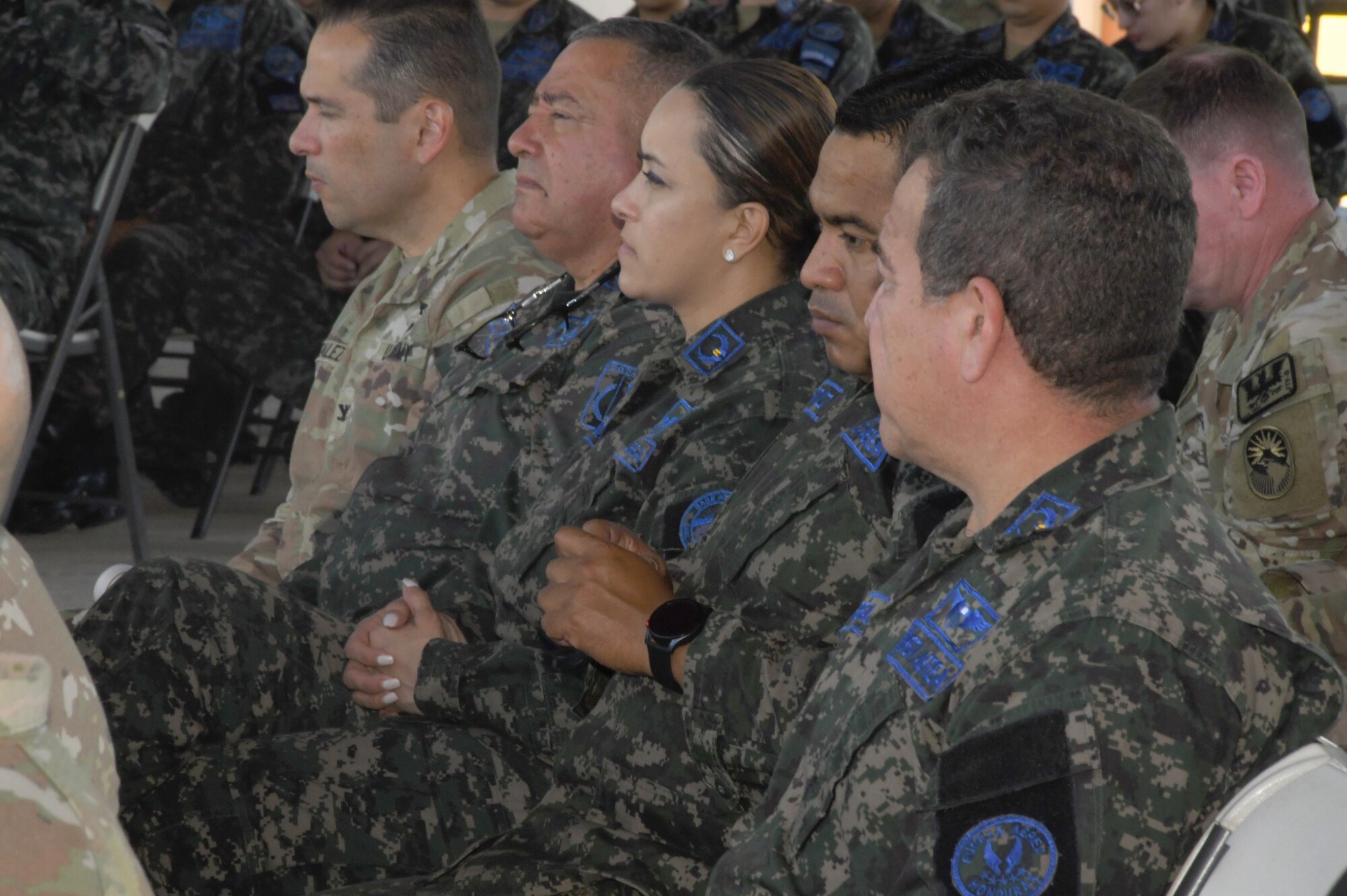 A photo of service members watching.