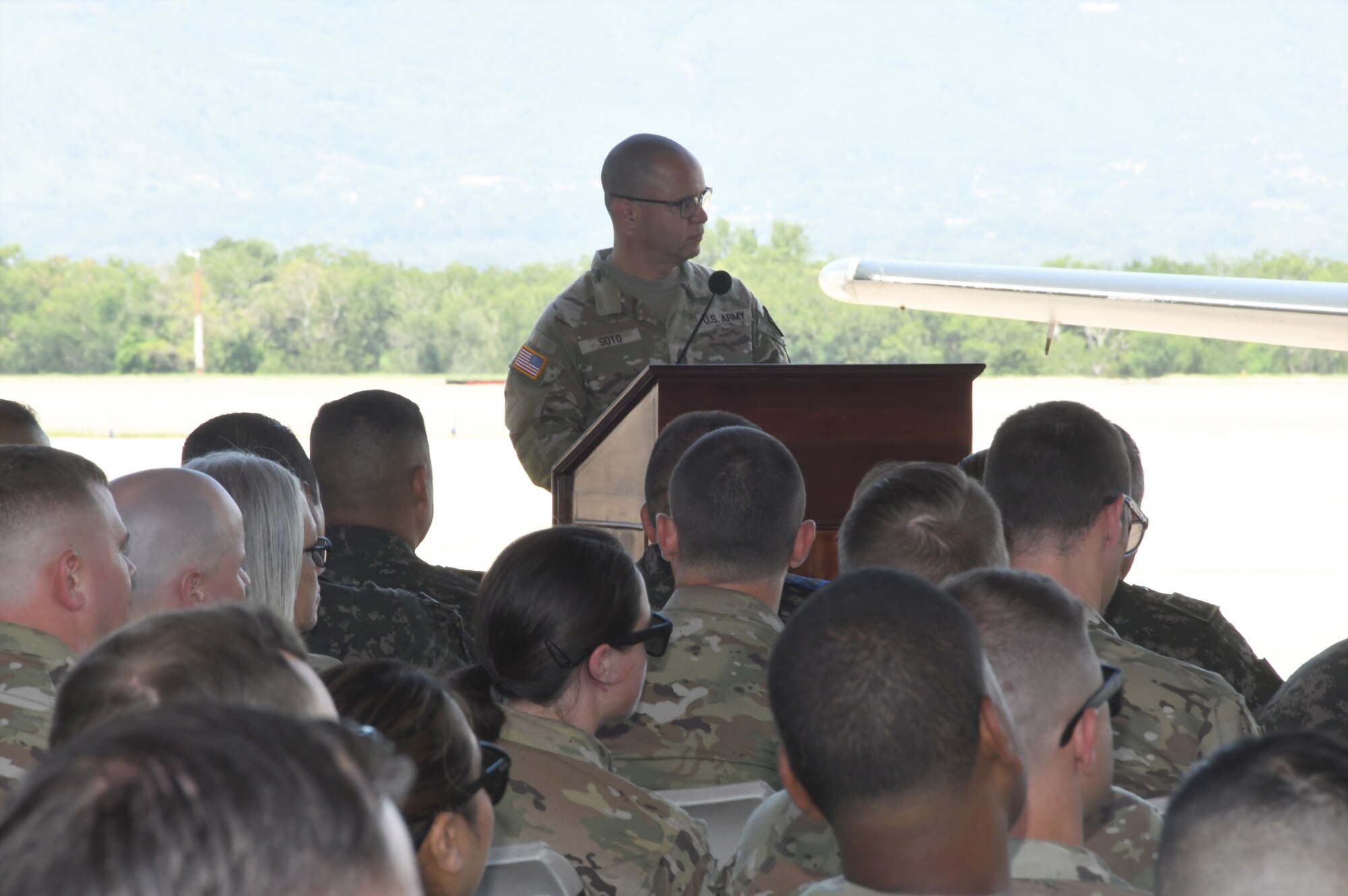 A photo of a Soldier specking to a crowd.
