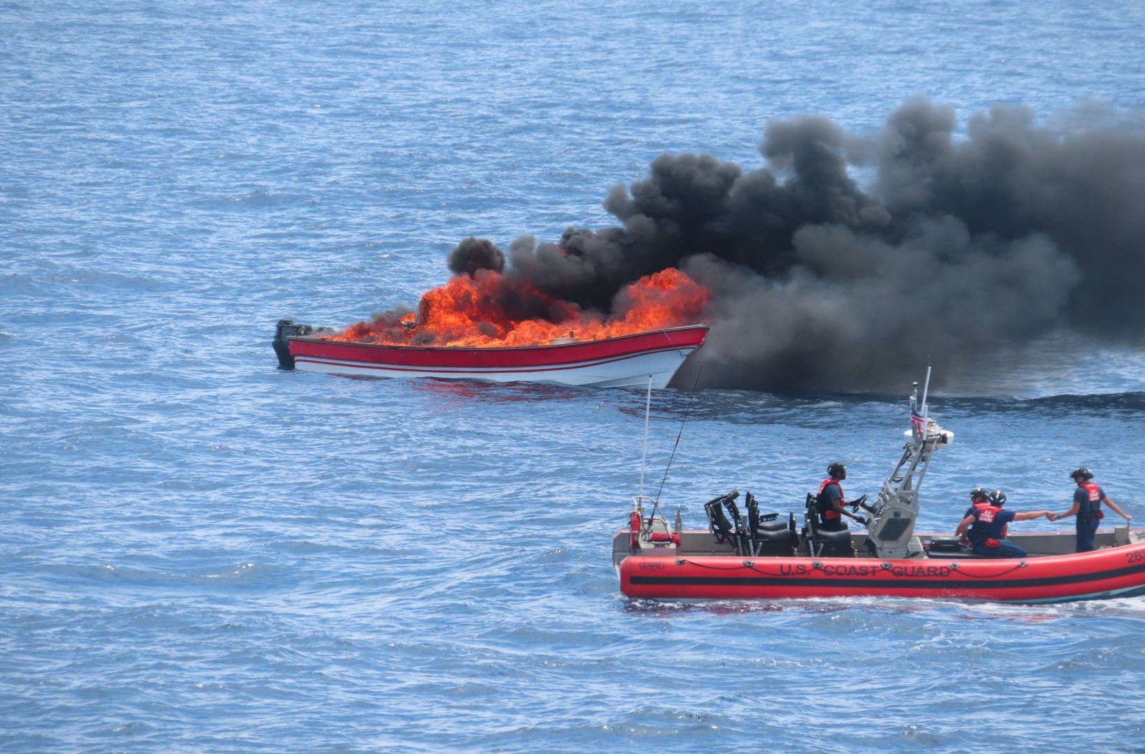 A U.S. Coast Guard Cutter Escanaba (WMEC 907) boat crew destroys a go-fast vessel interdicted in the Eastern Pacific Ocean, July 28, 2024. The crew of USCGC Escanaba offloaded more than 3,400 pounds of cocaine and 4,410 pounds of marijuana with a combined assessed street value of approximately $50 million in Port Everglades, Florida, Aug. 23, 2024. (U.S. Coast Guard photo by Petty Officer 3rd Class Nadia Sands)