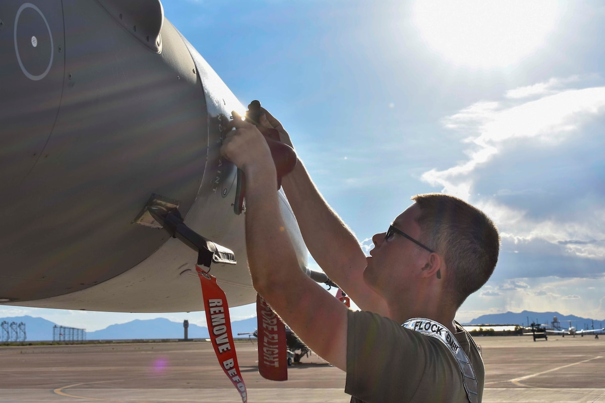 U.S. Air Force Senior Airman Brandon Carlo, 849th Aircraft Maintenance Squadron weapons load member, performs pre-flight inspection during Project Iron Agility at Holloman Air Force Base, New Mexico, Aug. 15, 2024. The maintenance knowledge curriculum taught at PIA implements training tactics and procedures to prepare Airmen for deployment scenarios. (Courtesy photo)