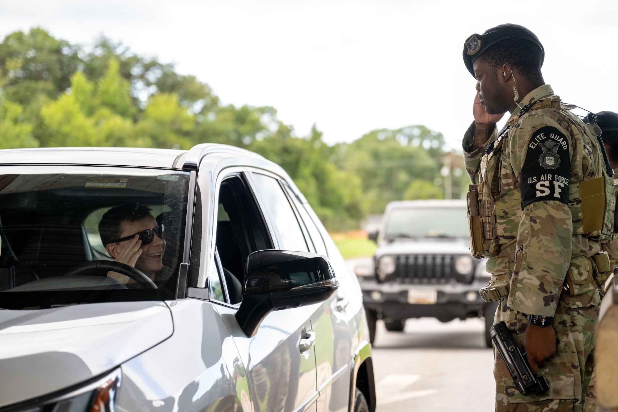 A response force leader assigned to the elite guard section salutes an officer at the Virginia Gate.