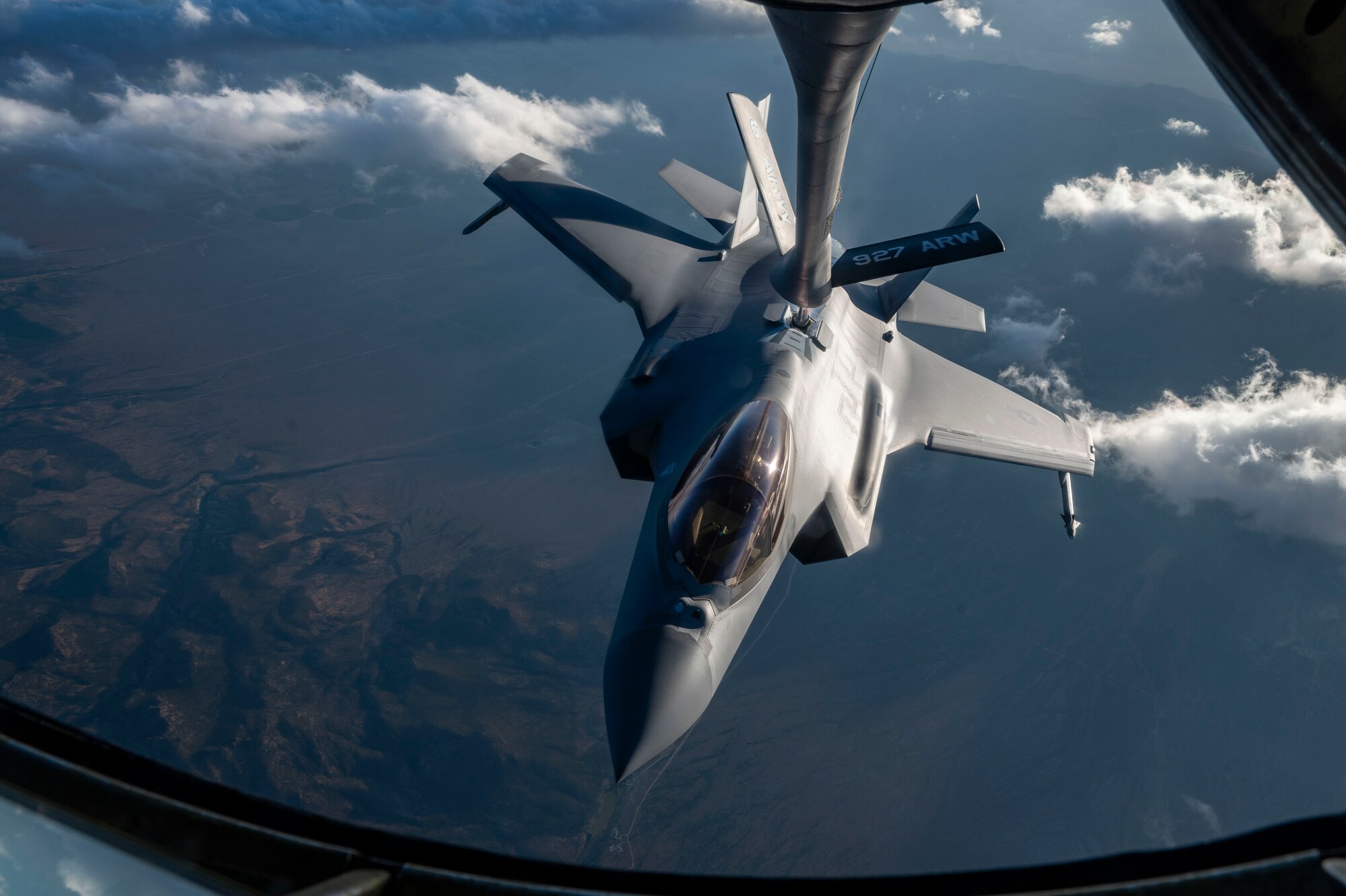 An F-35A Lightning II receives fuel while flying.