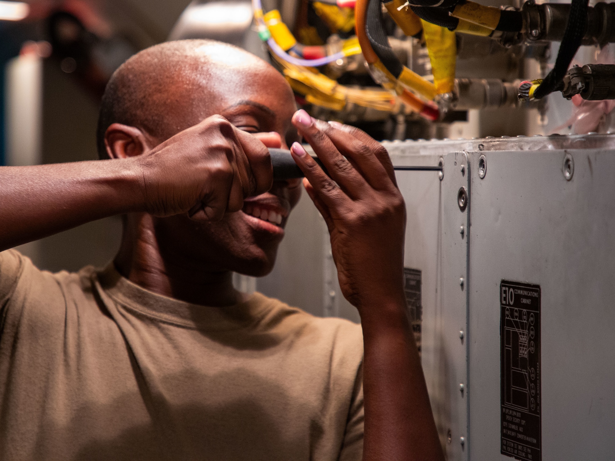 Master Sgt. Abbey Wallace, an airborne radio operator from the 965th Airborne Air Control Squadron, conducts preflight checks onboard an E-3 Sentry during Bamboo Eagle 24-3 at Nellis Air Force Base, Nev., Aug. 8, 2024. The 965th AACS ensures seamless communication for the E-3 during this critical exercise, enhancing the coordination and effectiveness of joint and allied air operations. (U.S. Air Force photo by Garrett N. Cole)
