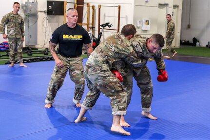 Approximately 30 U.S. Army Soldiers with the Pennsylvania National Guard participate in a five-day Army Combatives training program August 12-16 at Fort Indiantown Gap. Army Combatives trains leaders and Soldiers in close quarters combat to instill the Warrior Ethos and prepare Soldiers to defeat the enemy in hand-to-hand combat. (U.S. Army National Guard photo by Sgt. 1st Class Zane Craig)