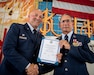 Chief Master Sgt. Anthony Schmidt, right, fire chief for the 123rd Civil Engineer Squadron’s Fire and Emergency Flight, receives a certificate of retirement from Lt. Col. Jarret Goddard, commander of the 123rd Civil Engineer Squadron, during Schmidt’s retirement ceremony at the Kentucky Air National Guard Base in Louisville, Ky., July 19, 2024. Schmidt is retiring after more than 37 years of service to the Kentucky Air National Guard. (U.S. Air National Guard photo by Master Sgt. Joshua Horton)