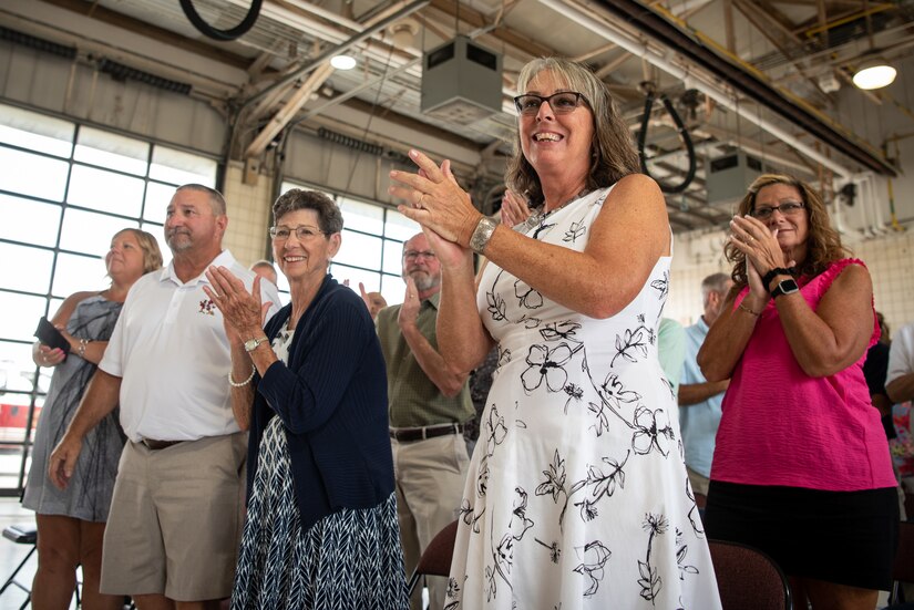 A crowd of friends, family and fellow Airmen attend the retirement ceremony of Chief Master Sgt. Anthony Schmidt, fire chief for the 123rd Civil Engineer Squadron’s Fire and Emergency Flight, at the Kentucky Air National Guard Base in Louisville, Ky., July 19, 2024. Schmidt is retiring after more than 37 years of service to the Kentucky Air National Guard. (U.S. Air National Guard photo by Master Sgt. Joshua Horton)