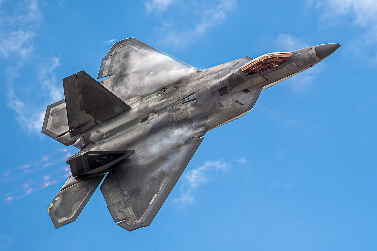 An F-22 Raptor with the Air Combat Command F-22 Raptor Demonstration Team performs a flyover