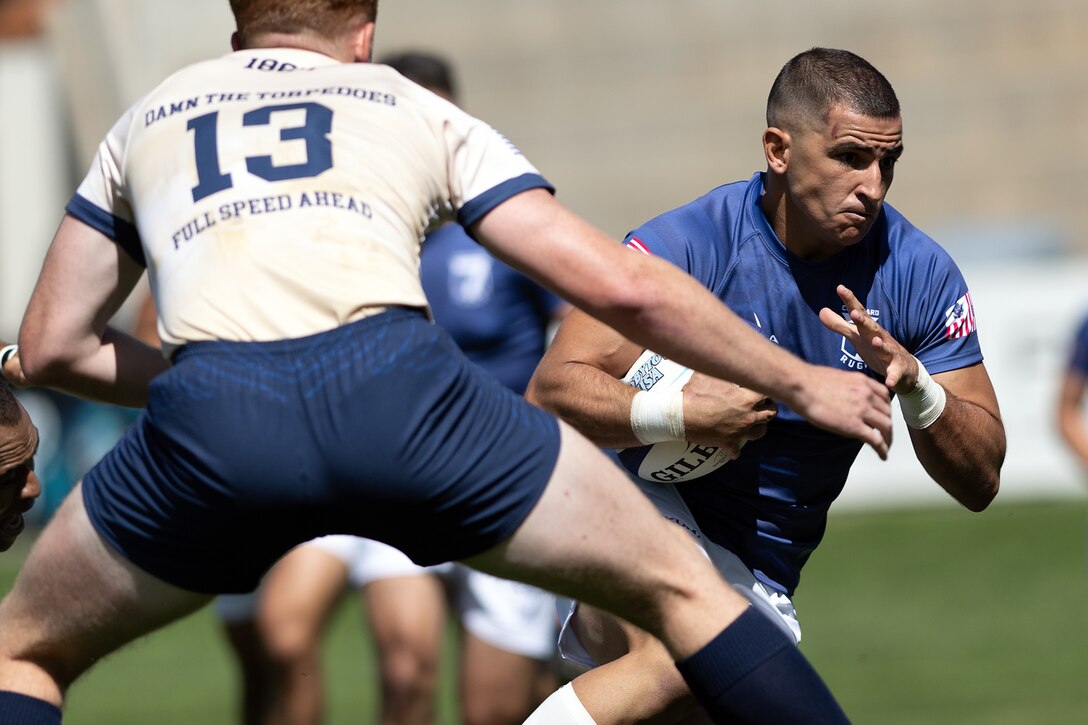 Coast Guard Lt. Joseph Rizzardi evades a tackle to score a try during the 2024 Armed Forces Men’s Rugby Championship hosted at Infinity Park in Glendale, Colo. Aug. 23, 2024. (DoD photo by EJ Hersom)