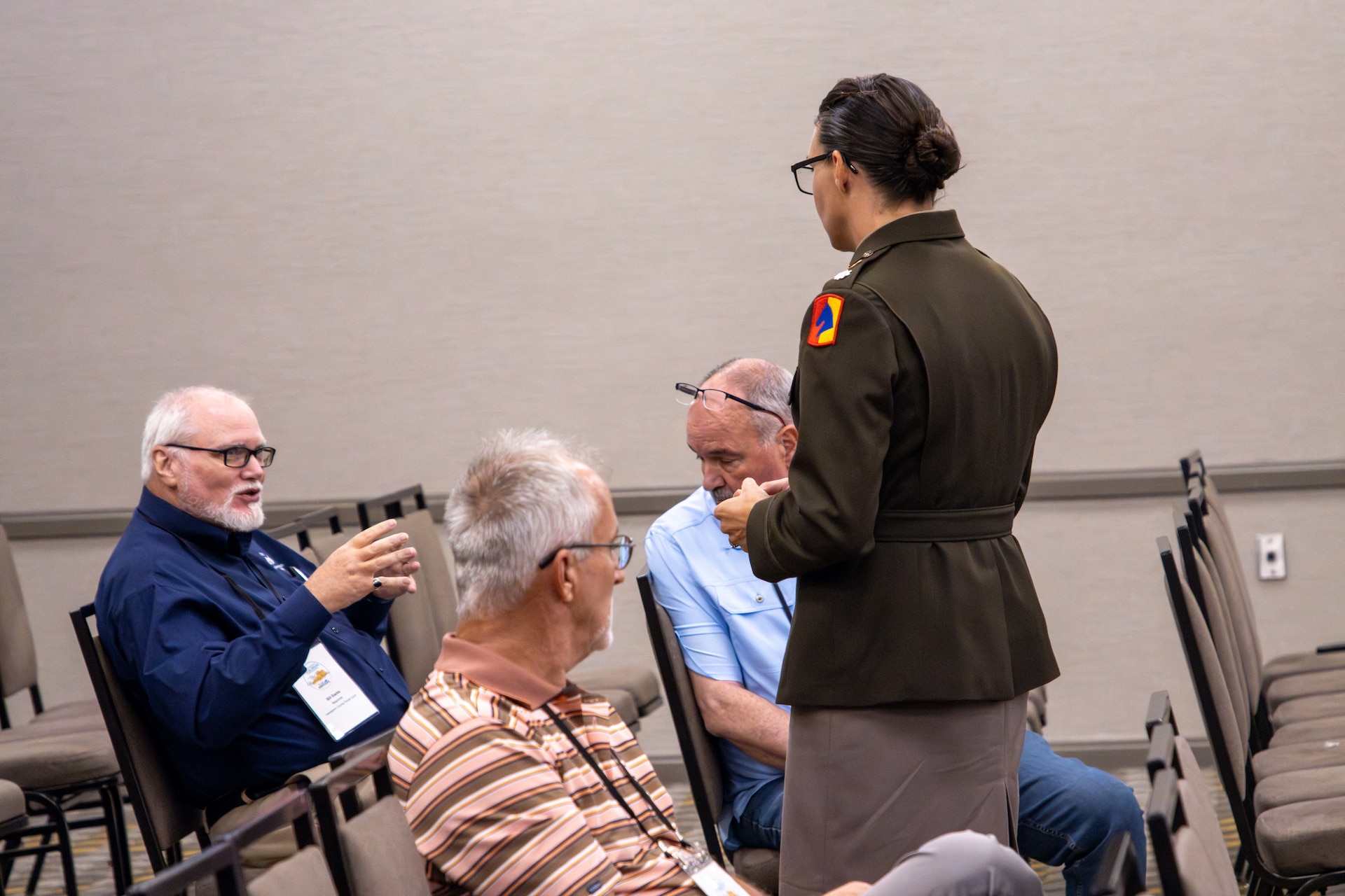 Lt. Col. Dayna Sanders speaks to representatives during the governor's Local Issues Conference