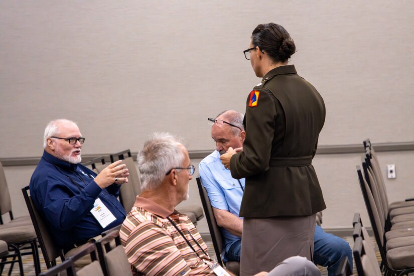 Lt. Col. Dayna Sanders speaks to representatives during the governor's Local Issues Conference