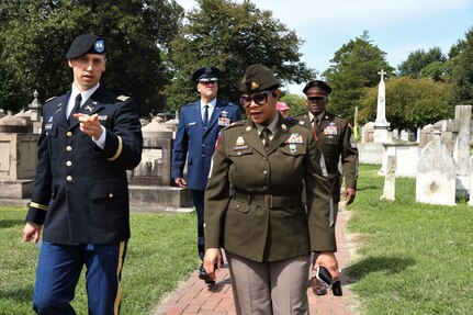 Members of the District of Columbia National Guard in collaboration with Historic Congressional Cemetery participate in a community-wide program and wreath laying ceremony honoring the dozens of D.C. Militia members buried at the cemetery who fought in the Battle of Bladensburg, in Washington, D.C., on Aug. 24, 2024. The ceremony featured remarks from various speakers and recognized the Militiamen who defended the nation’s capital on August 24, 1814.