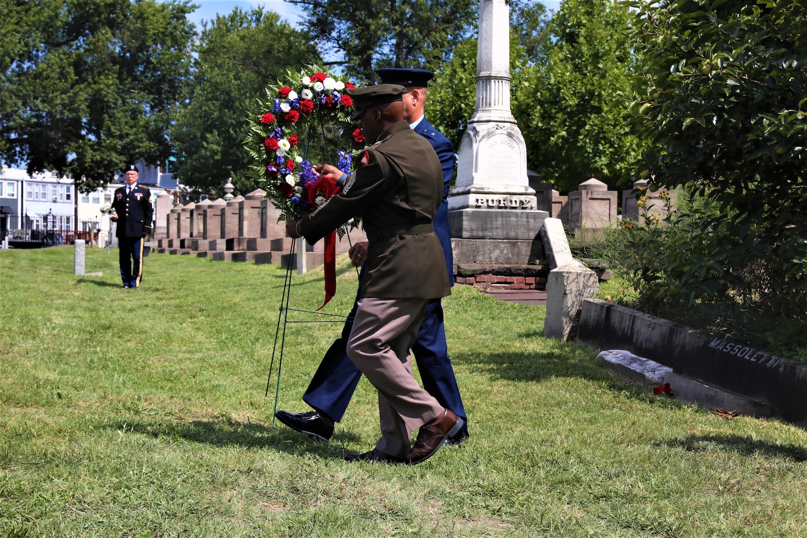 Members of the District of Columbia National Guard in collaboration with Historic Congressional Cemetery participate in a community-wide program and wreath laying ceremony honoring the dozens of D.C. Militia members buried at the cemetery who fought in the Battle of Bladensburg, in Washington, D.C., on Aug. 24, 2024. The ceremony featured remarks from various speakers and recognized the Militiamen who defended the nation’s capital on August 24, 1814.