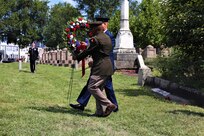 Members of the District of Columbia National Guard in collaboration with Historic Congressional Cemetery participate in a community-wide program and wreath laying ceremony honoring the dozens of D.C. Militia members buried at the cemetery who fought in the Battle of Bladensburg, in Washington, D.C., on Aug. 24, 2024. The ceremony featured remarks from various speakers and recognized the Militiamen who defended the nation’s capital on August 24, 1814.