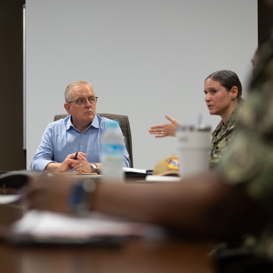 Mr. David Giachetti, a professional staff member for the House Armed Services Committee, U.S. House of Representatives, listens as U.S. Navy Cmdr. Jacqueline Lopez, the officer in charge of Naval Family Branch Clinic Iwakuni and a native of Texas, explains the resources and capabilities they provide at Marine Corps Air Station Iwakuni, Japan, Aug. 19, 2024. The professional staff members for the U.S. House of Representatives visit MCAS Iwakuni to discuss the air station’s unique capabilities and future improvements for the base. (U.S. Marine Corps photo by Cpl. Peter Rawlins)