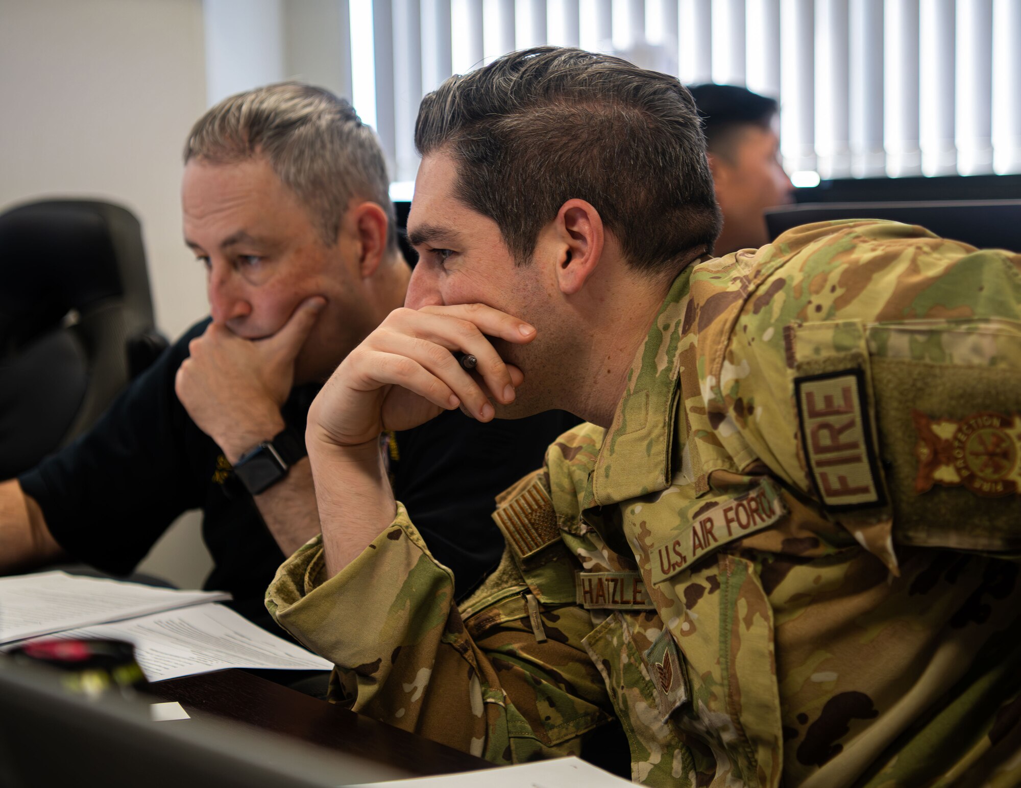 A Service member and DoD employee work together during the Plans Examiner Course