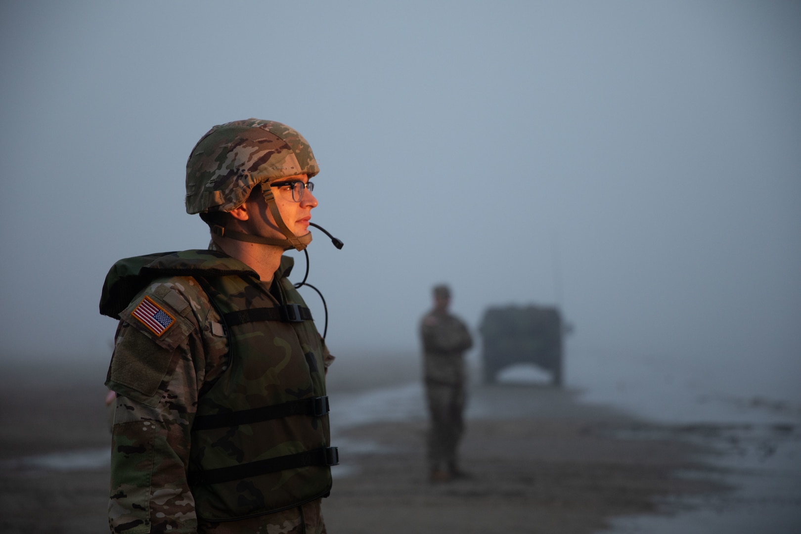 U.S. Army Sgt. Zachary Obrigewitch, a bridge crew member with the 957th Multi-role Bridge Company, North Dakota Army National Guard, waits to guide other Soldiers during boat launching operations as part of a wet gap crossing training exercise near Kimball Bottoms, North Dakota, Aug. 17, 2024. The exercise was part of a joint operation to test the unit’s ability to establish vital infrastructure in domestic and combat scenarios.