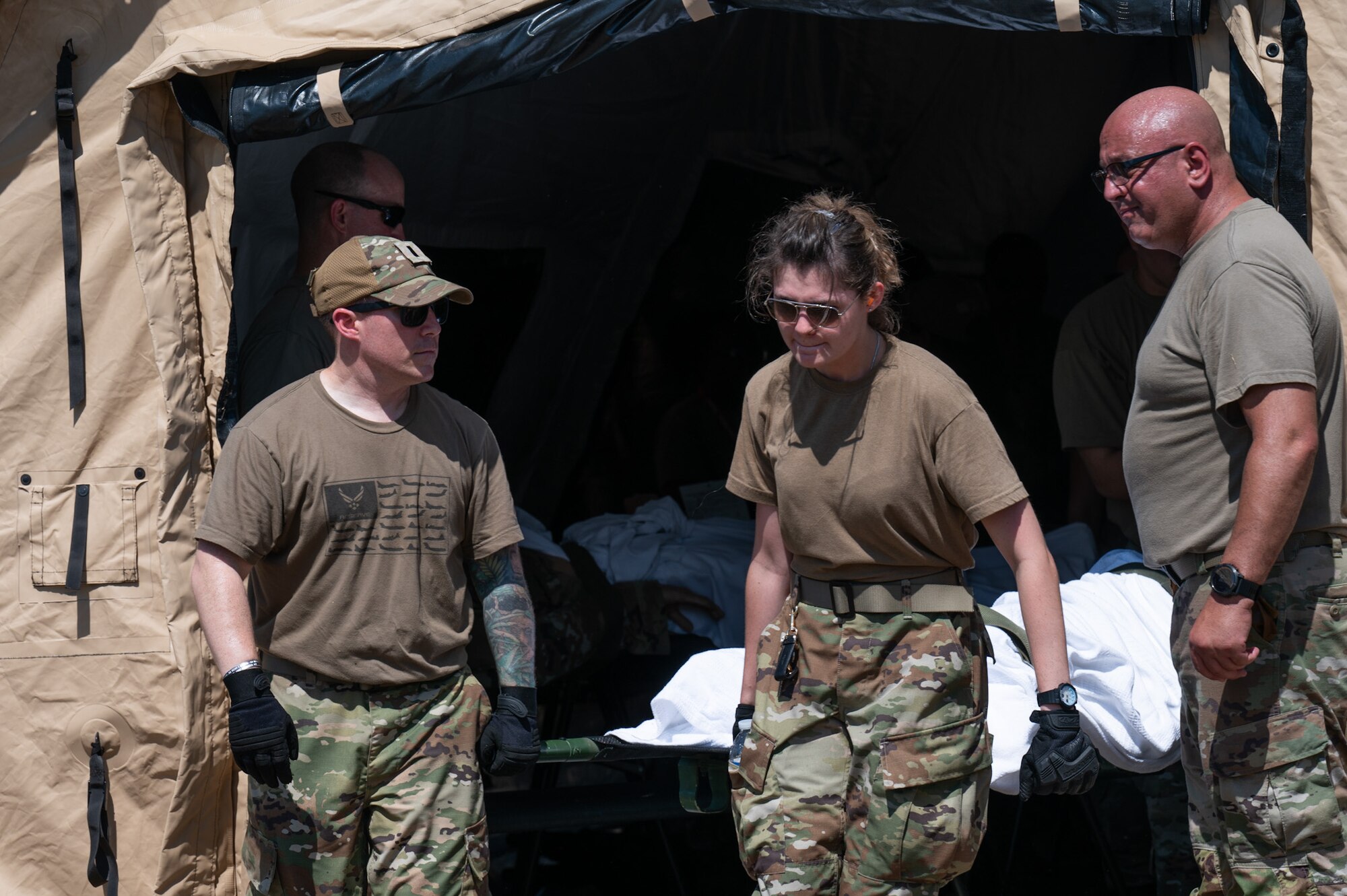 The 927th Aeromedical Staging Squadron conducts patient care inside of an en-route patient staging system tent during Operation Blue Horizon on MacDill AFB, June 6, 2024. Blue Horizon was a Navy Reserve-led joint exercise giving total-force medics, doctors, nurses and other military healthcare professionals the chance to experience the full depth of tactical combat casualty care and aeromedical evacuation. (U.S. Air Force photo by Tech. Sgt. Bradley Tipton)