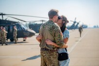 Family, friends and coworkers gathered on Gowen Field Aug. 22, 2024, to say farewell to Soldiers from the Idaho Army National Guard’s 1st of the 183rd Assault Helicopter Battalion as they left Idaho to prepare to deploy overseas to support Operation Joint Guardian. Several UH-60M Black Hawk helicopters and more than 100 personnel deployed to Texas for additional training before departing to Kosovo for an 11-month rotation supporting the NATO peacekeeping mission.