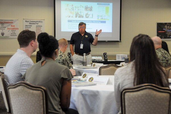 William Stover, the Environmental Program’s department head, at the Navy and Marine Corps Force Health Protection Command addresses the students during a risk communication workshop Aug. 13, 2024, at the Rivers Edge Conference Center, on Naval Medical Center Portsmouth, Virginia. The risk communication workshop focused on how to plan and execute communications to internal and external stakeholders on any public health issue that impacts their mission. (Navy photo by Desmond Martin)