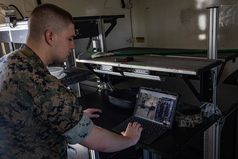 U.S. Marine Corps Cpl. Tyler Havard, from Arizona, a ground electronics transmissions systems maintainer with 2nd Maintenance Battalion, 2nd Marine Logistics Group, tests tele-maintenance capabilities at Marine Corps Air Station Cherry Point, North Carolina, Aug. 21, 2024. Marine Depot Maintenance Command is experimenting with augmented reality technology as part of its effort to modernize its maintenance capabilities from industrial-era practices to technologies suitable and capable of meeting the demands of the Information Age. (U.S. Marine Corps photo by Lance Cpl. Orlanys Diaz Figueroa)