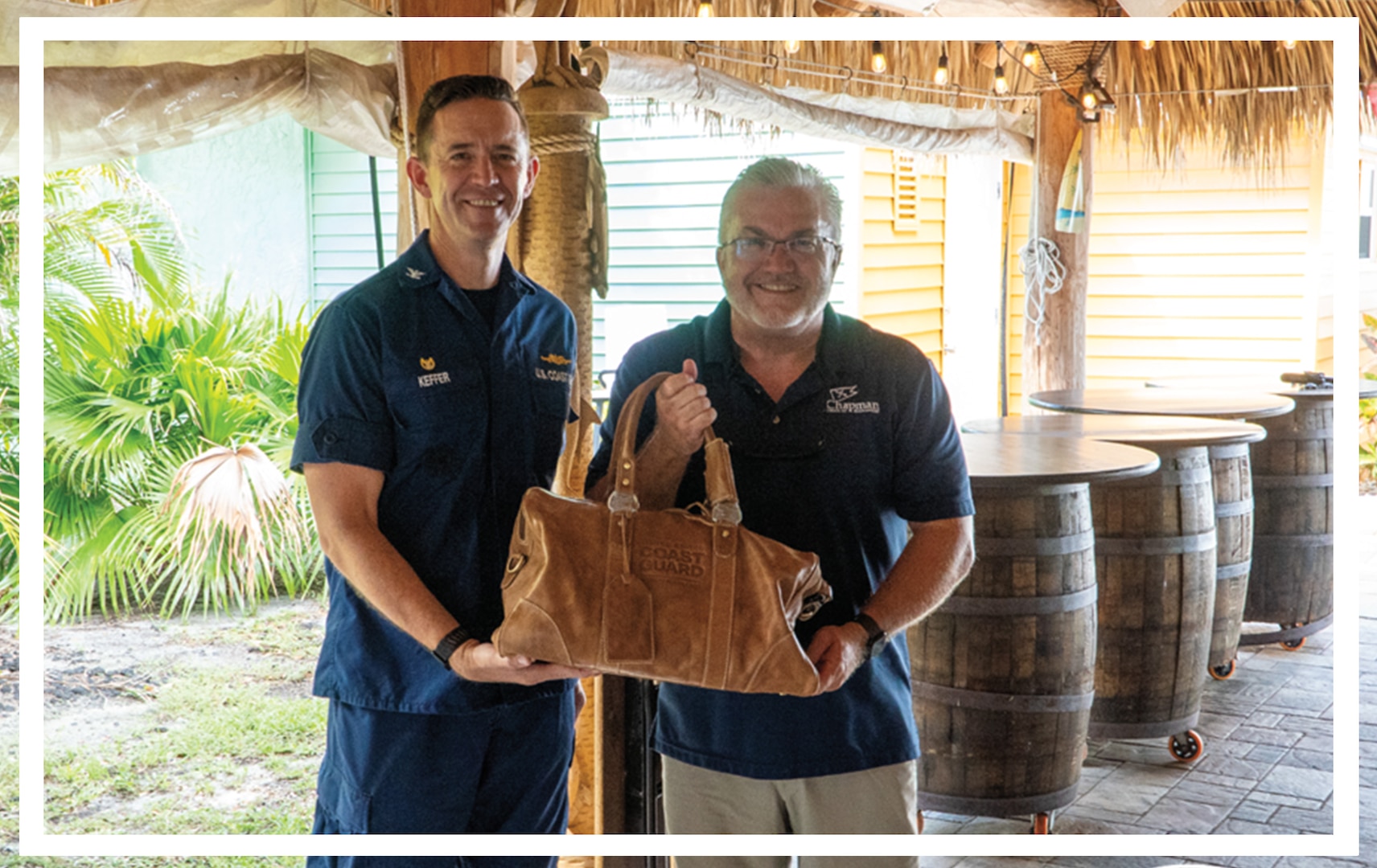 CAPT Benjamin Keffer of CG Recruiting Command and Mr. Jim Allen, Executive Director of Chapman School of Seamanship, celebrate an updated Letter of Intent (LOI) at a recognition ceremony. The new LOI includes both BM and MK ratings for graduates of Chapman's Yamaha outboard program.