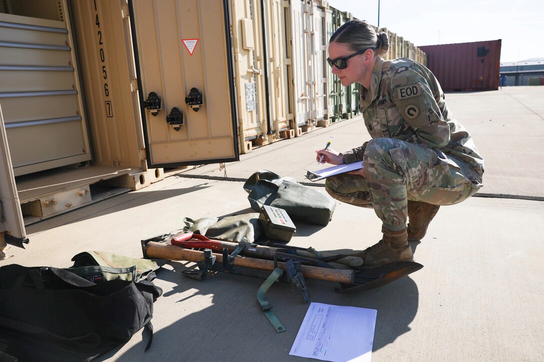 Capt. Mckenzie N. Elliott, commander, Headquarters and Headquarters Company, Special Troops Battalion, 1st Theater Sustainment Command, conducts inventory at the unit's motor pool August 23, 2024, Fort Knox, Kentucky. Elliott is a member of the small, tight-knit Explosive Ordnance community.