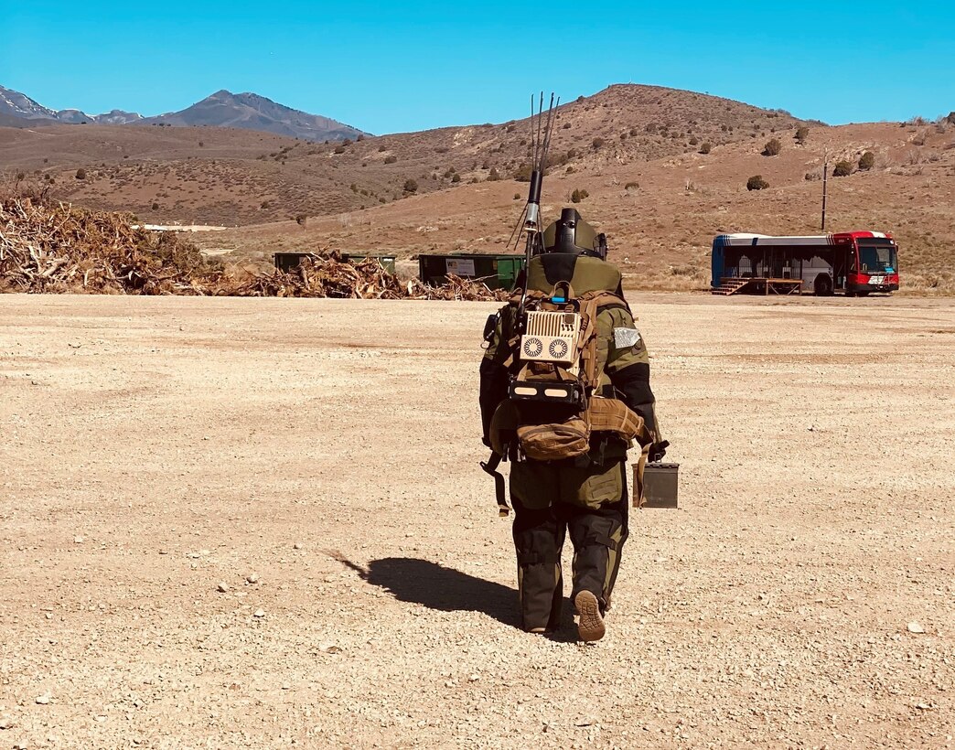 Capt. Mckenzie N. Elliott, commander, Headquarters and Headquarters Company, Special Troops Battalion, 1st Theater Sustainment Command, wears an 85-pound bomb suit in Utah. Elliott is an Explosive Ordnance Officer trained to conduct explosive operations under the most adverse conditions.